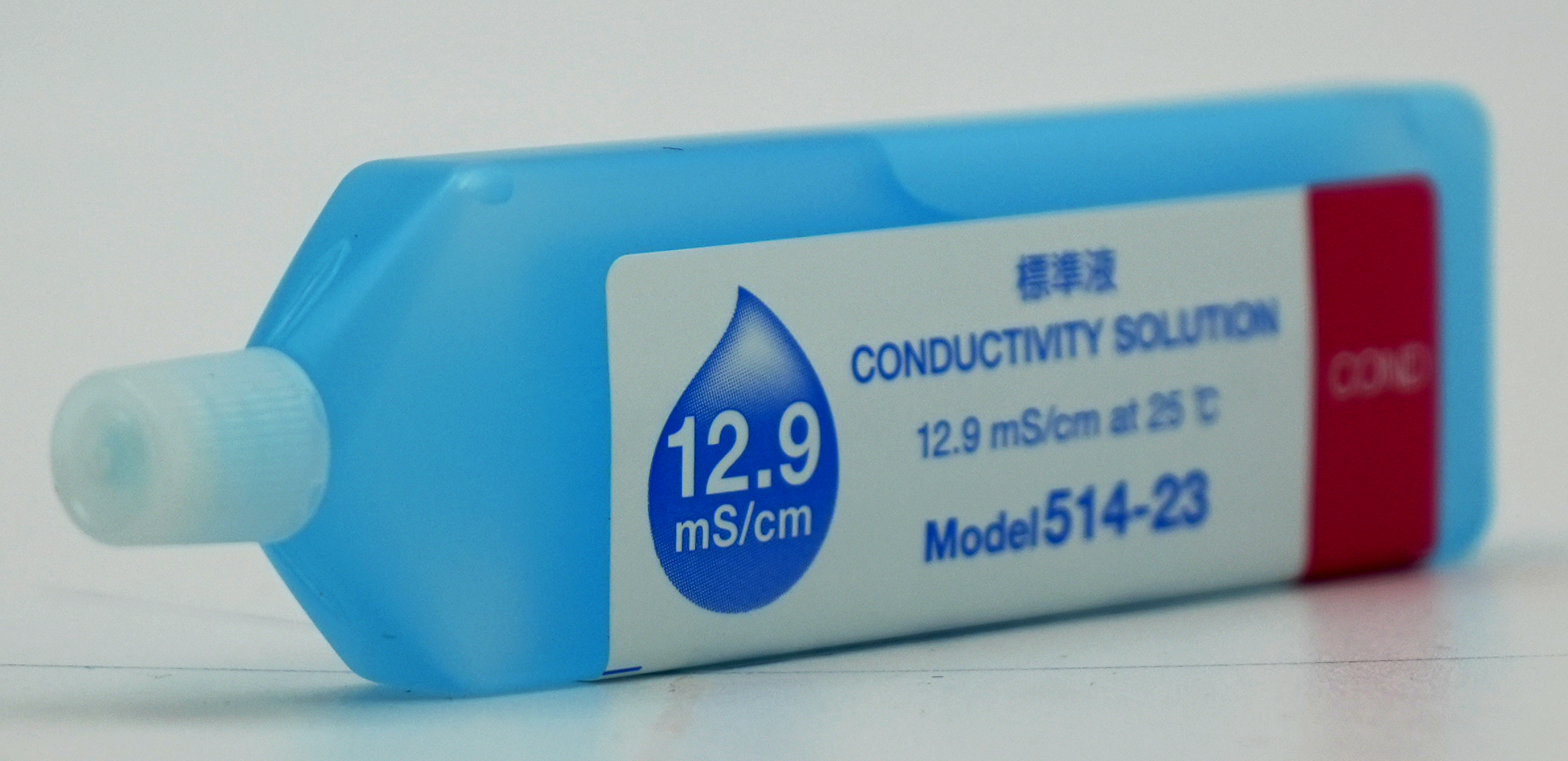 Horiba 12.9 mS/cm conductivity standard, angled view with label and cap