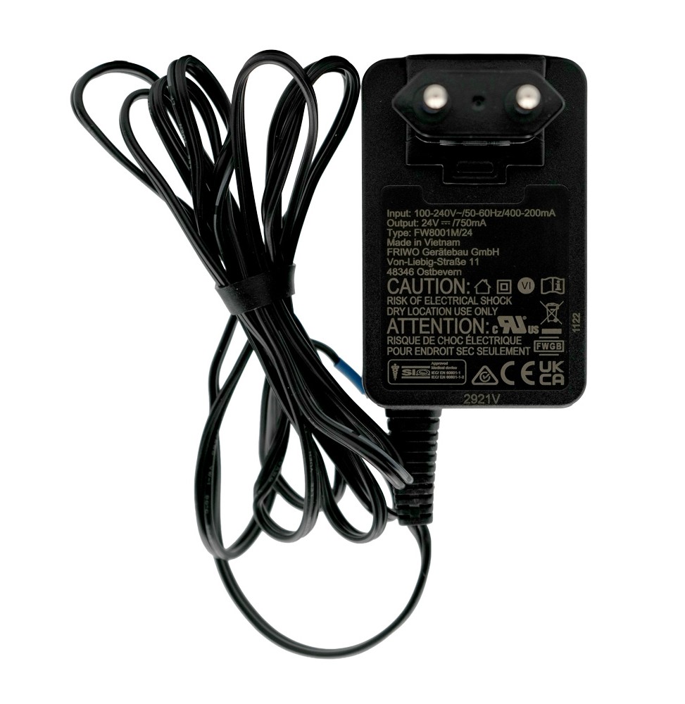 Plug-in power supply for Testomat LIMIT, our item number 30996, standing on the left-hand side with cable in the foreground